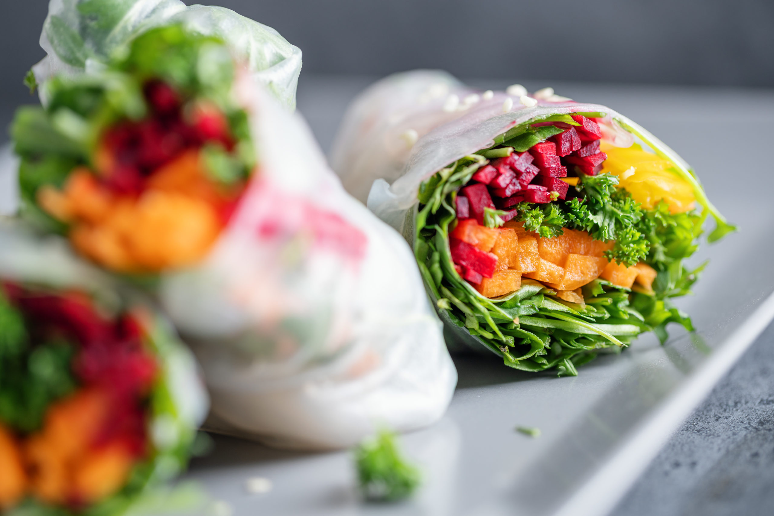 vegan rice paper rolls with vegetables sesam served plate ready eat